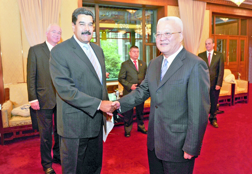 周吉平拜會委內(nèi)瑞拉總統(tǒng)馬杜羅(圖1)